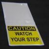 CAUTION - Watch your step hanging sign